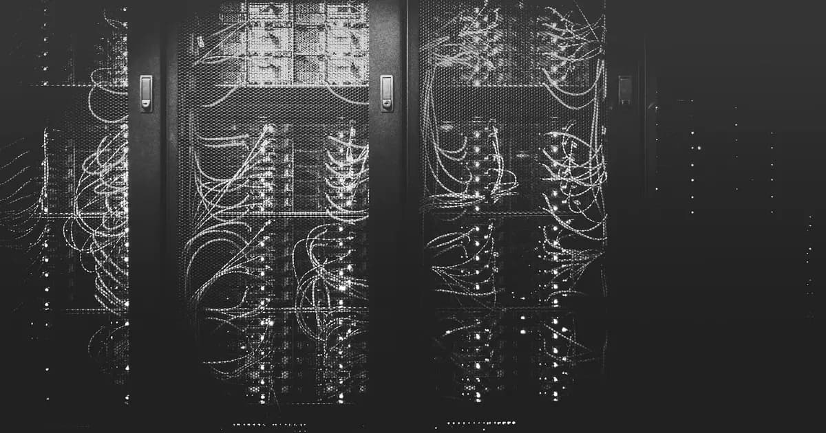 Black-and-white server racks and network cabling in a data center
